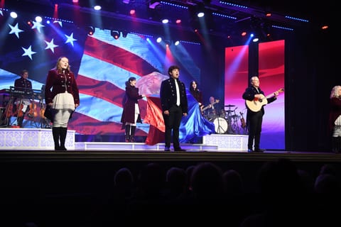 The Duttons performing in patriotic stage lighting