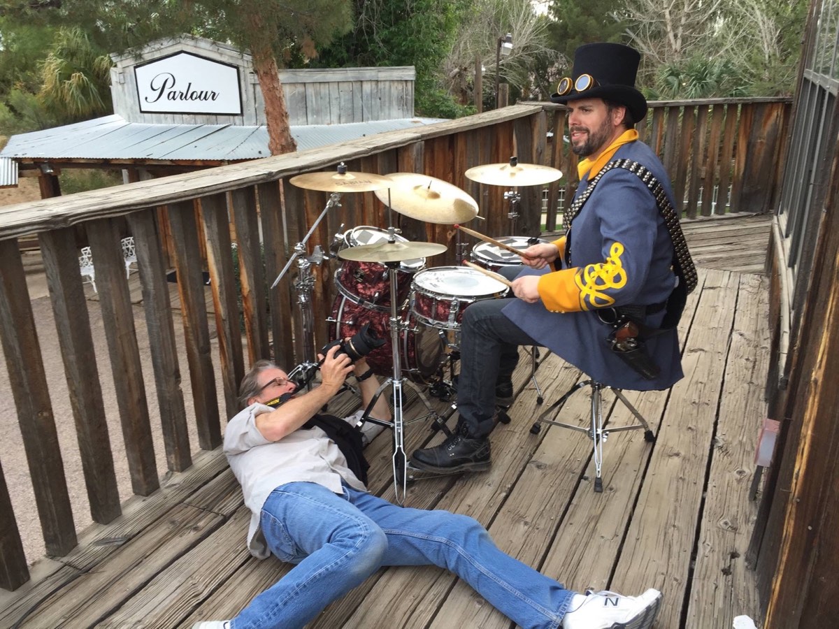 Michael Schaertl photographing a Duttons music video from a wooden deck